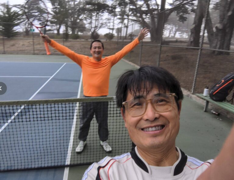 Tony smiling at McLaren Park with Tim celebrating behind him